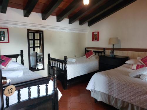 Ένα ή περισσότερα κρεβάτια σε δωμάτιο στο Casa Mia Hotel