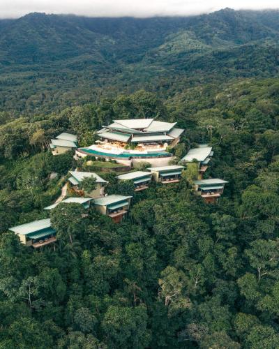 an overhead view of a group of houses in the forest at Hotel Three Sixty - Adults Only in Ojochal