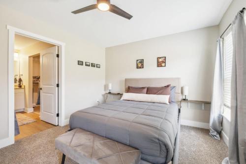 a bedroom with a bed and a ceiling fan at A pet friendly cozy condo in Traverse City in Traverse City