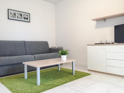 a living room with a couch and a table at Apartments Lucija in Portorož