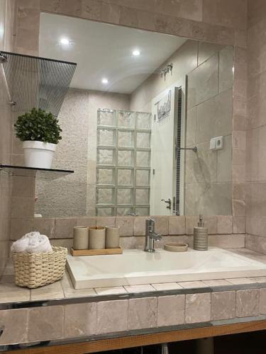 a bathroom counter with a sink and a mirror at Beautiful Marbella Apartment in Marbella