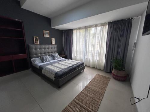 Postel nebo postele na pokoji v ubytování TORRE EJECUTIVA hotel
