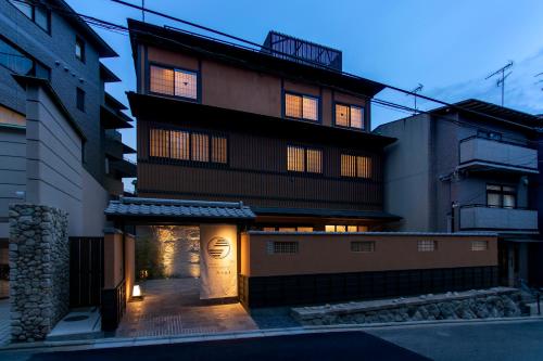 a building with its lights on in the night at Hotel Ethnography Kiyomizu Gojo in Kyoto