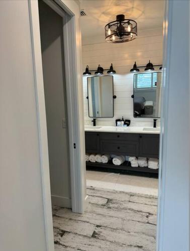 a bathroom with a sink and a mirror at Newly built home in Cudjoe Key in Cudjoe Key