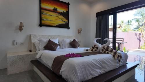 Ένα ή περισσότερα κρεβάτια σε δωμάτιο στο Relax Villas Gili Air