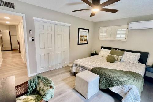 a bedroom with a bed and a ceiling fan at Apartment A, Restful,Cozy, close Sunland Park Mall in El Paso