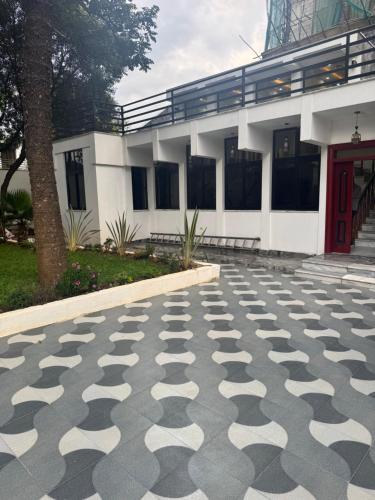 a building with a geometric pattern on the ground at Bole villa in Addis Ababa