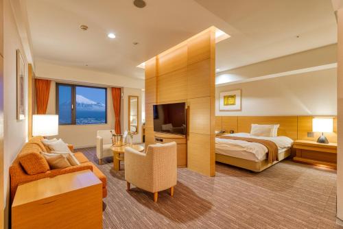 Ένα ή περισσότερα κρεβάτια σε δωμάτιο στο Hotel Grand Fuji
