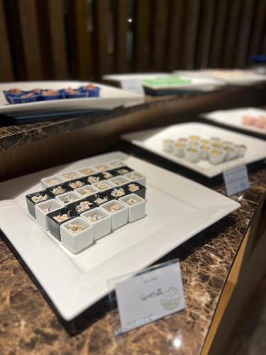 a tray of cupcakes sitting on a counter at glampark Keburikawa Kyoto in Kameoka