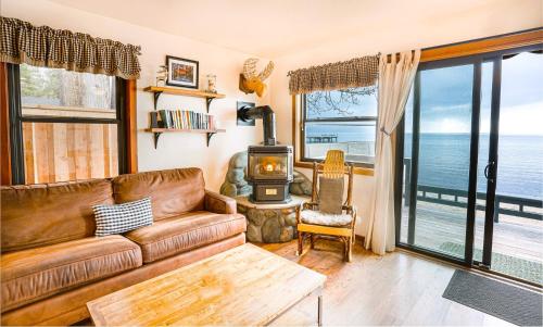 a living room with a couch and a wood stove at On The Beach in Tahoe Vista