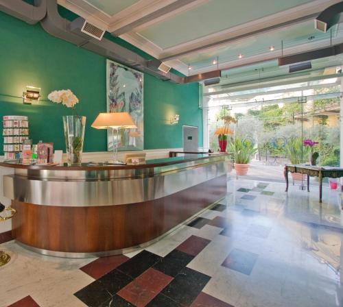 a bowling alley in a room with green walls at Ateneo Garden Palace in Rome