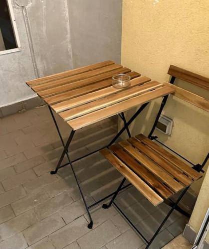 a wooden table with a bowl on top of it at casa di bea rozzano humanitas unipol forum ieo in Rozzano