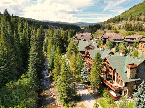an aerial view of a resort with trees at Union Creek Townhome 144C New Listing! townhouse in Copper Mountain