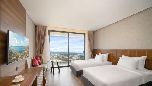 Postel nebo postele na pokoji v ubytování Apec Mandala Hotel & Apartment Tuy Hòa