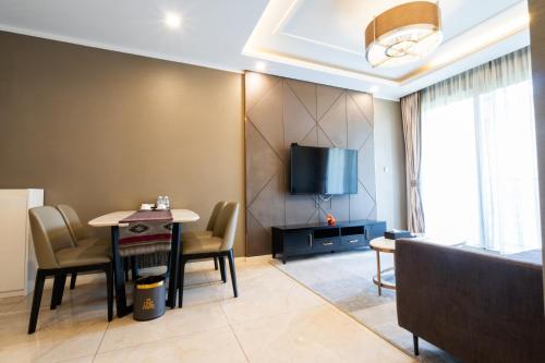 TV a/nebo společenská místnost v ubytování One Park Hotel & Residence