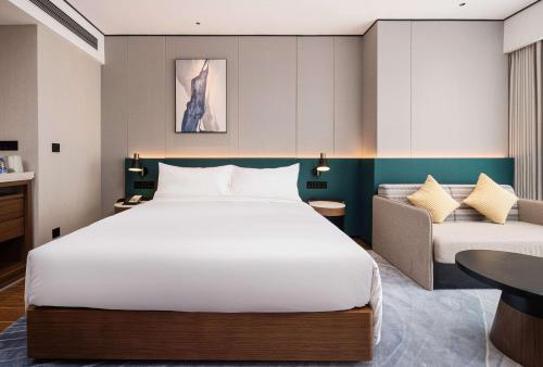 Katil atau katil-katil dalam bilik di Hilton Garden Inn Anqing Susong