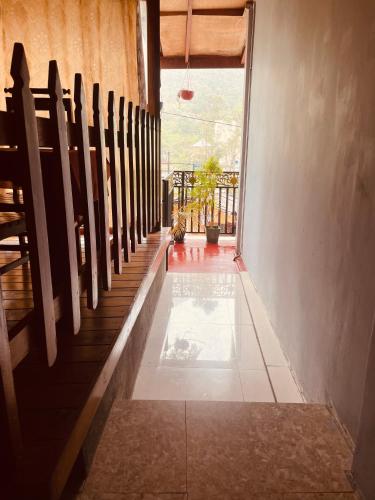 a hallway with a row of pews in a church at Singh Brothers in Adams Peak