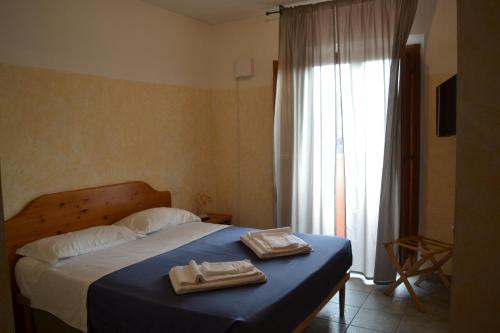 Postel nebo postele na pokoji v ubytování Ai canipai