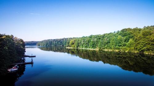 a view of a river with a boat on it at Lake Park Łagów in Łagów