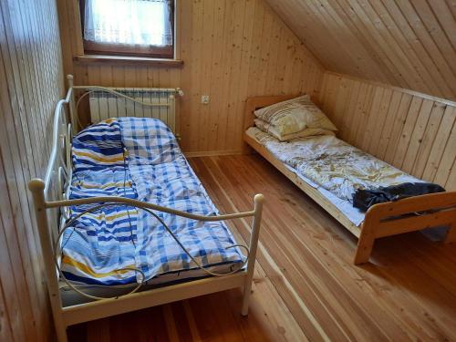 Postel nebo postele na pokoji v ubytování Cicha przystań na Madejach