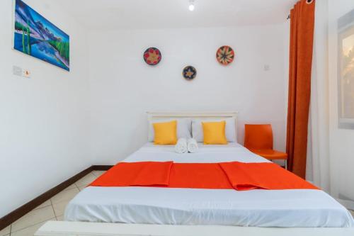 Кровать или кровати в номере Pontoon Residences & Suites