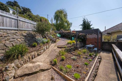 a garden with a tent and some plants at Modern 3-Bed Coastal Escape in Burnie