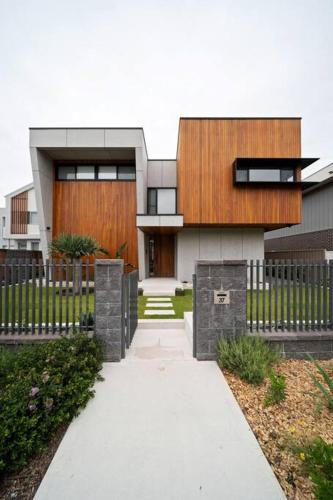 a house with a fence in front of it at Blvd Dream in Shellharbour