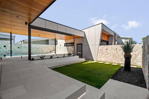 an external view of a house with a garden at Blvd Dream in Shellharbour