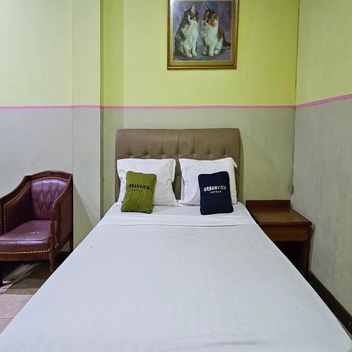 Katil atau katil-katil dalam bilik di Urbanview Hotel Kharisma Banjarmasin