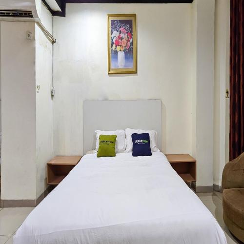Katil atau katil-katil dalam bilik di Urbanview Hotel Kharisma Banjarmasin