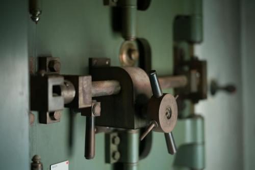 a close up of a sewing machine on a wall at Toyooka1925 in Toyooka