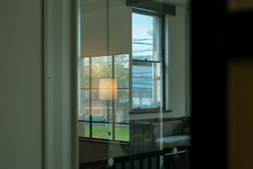 a window in a room with a view of a building at Toyooka1925 in Toyooka