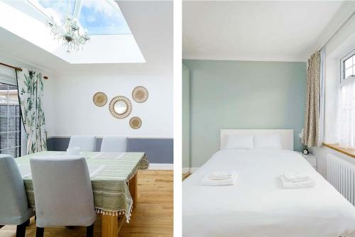 a bedroom with a bed and a dining room with a table at Stunning Family Bungalow With Private Parking in Dagenham