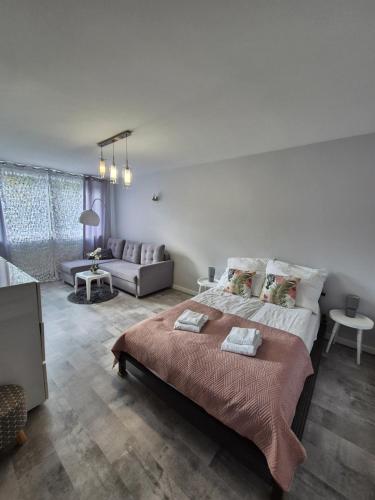 Posteľ alebo postele v izbe v ubytovaní Górski Apartament