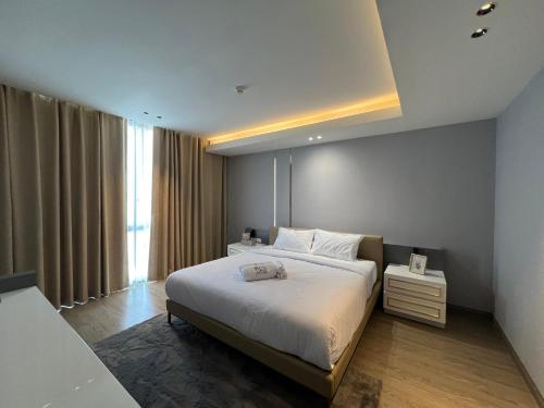 Giường trong phòng chung tại Nue Luxury Hatyai Resident - Benu