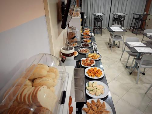 a buffet line with many different plates of food at Hotel Motel 2 in Castel San Giovanni
