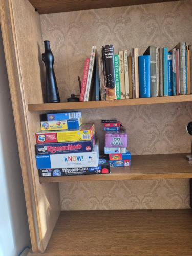 a book shelf with a bunch of books on it at Wohnung Unterkrone 4 Betten in Witten