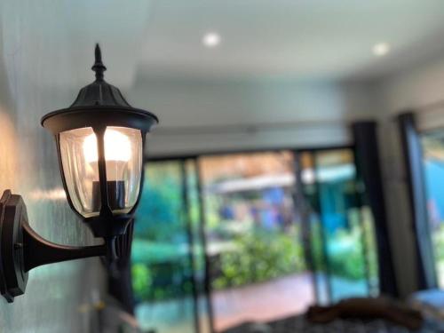 a street light with a window in a room at Ingtara at Lanta in Ko Lanta