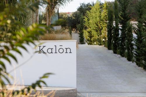 a sign for a garden with a walkway at Villa Kalōn in Rethymno Town