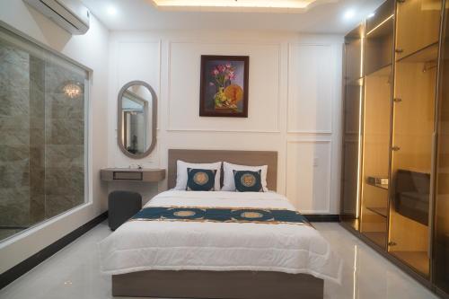 Ένα ή περισσότερα κρεβάτια σε δωμάτιο στο Queen Luxury Hotel Phan Rang
