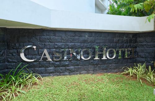 a sign for a building that says catepillar at Casino Hotel - CGH Earth, Cochin in Cochin