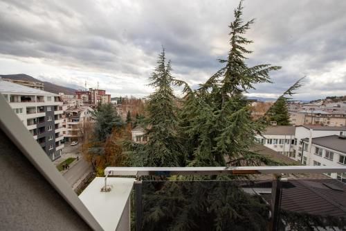 a balcony with two christmas trees on a city at Luxury Apartments Valentino in Ohrid