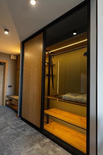 a room with a closet with a bed in it at Apartel Skhidnytsya in Skhidnitsa