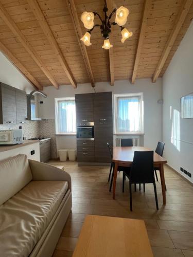 a living room with a couch and a table at Apartments Colombara Bardolino in Bardolino