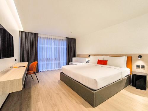 a hotel room with a bed and a desk at Citichic Sukhumvit 13 by Compass Hospitality - Newly Renovated in Bangkok