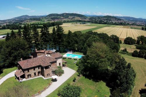 an aerial view of a house with a swimming pool at Villa Illuminata by MMega in Calzolaro