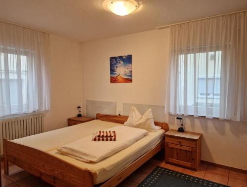a bedroom with a bed with chessetts on it at Gästehaus Schniepp in Stuttgart