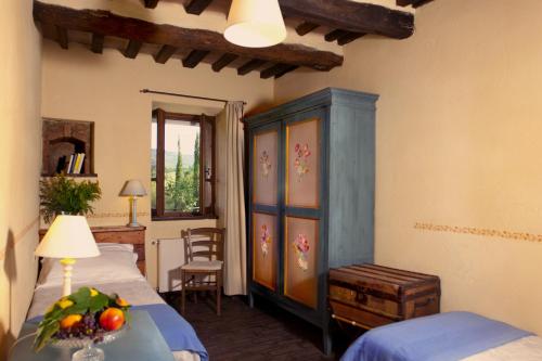 a bedroom with a bed and a table with fruit on it at Villa Illuminata by MMega in Calzolaro