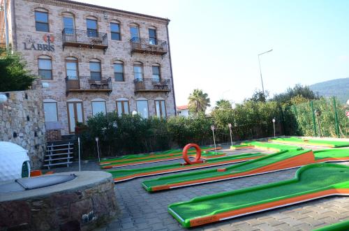 a row of skate ramps in front of a building at Cunda Labris Hotel in Ayvalık