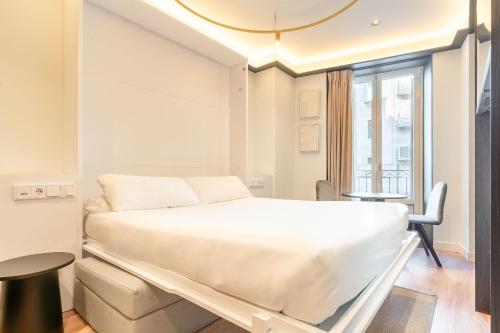 Ένα ή περισσότερα κρεβάτια σε δωμάτιο στο Limehome San Sebastian Zubieta Kalea